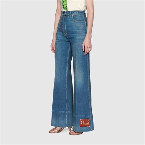 Washed denim flare pant with Gucci label 